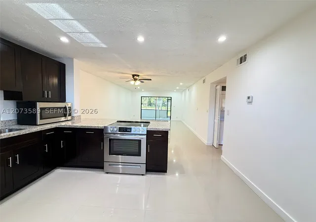 Listing Photo 4 - Condo for sale in building located at 6095 N Sabal Palm Blvd, Tamarac, FL 33319 - Unit #103