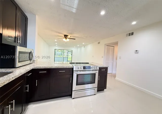 Listing Photo 5 - Condo for sale in building located at 6095 N Sabal Palm Blvd, Tamarac, FL 33319 - Unit #103