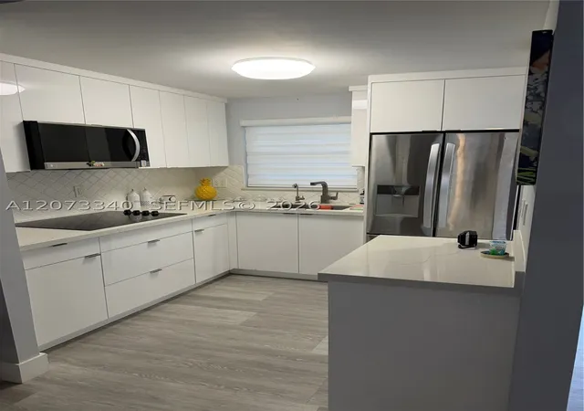 Photo 4 of Condo for sale at 8051 N Sunrise Lakes Dr #107, Sunrise, FL 33322 | MLS# A12073340 | Listing updated on 2026-09-11