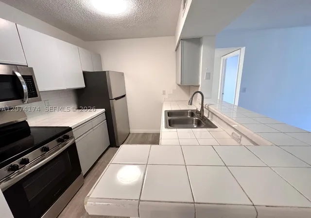 Listing Photo 5 - Condo for sale in building located at 4045 W Mcnab Rd, Pompano Beach, FL 33069 - Unit #G106