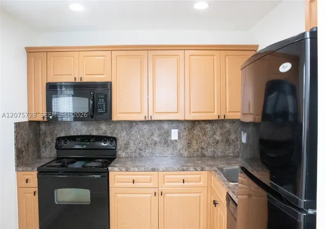 Listing Photo 2 - Condo for sale at Village Of Kings Creek, Unit L-406 7860 Camino Real, Village Of Kings Creek, Miami, FL 33143 | Built Year: 1972-1973