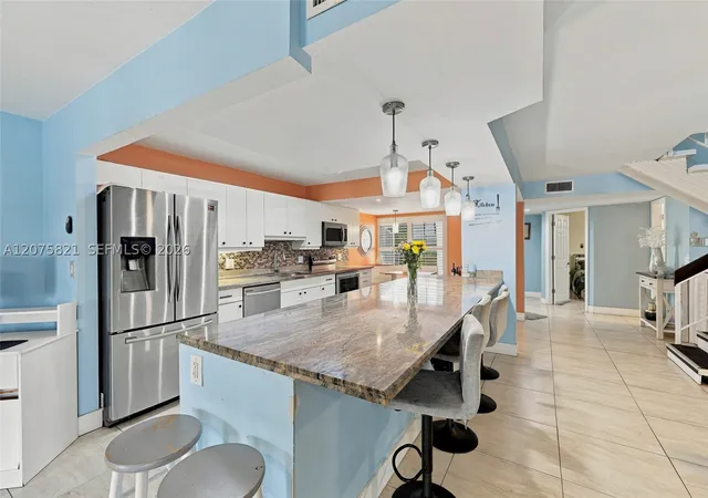 Photo 4 of Townhouse for sale at 958 Mockingbird Ln #513, Plantation, FL 33324 | MLS# A12075821 | Listing updated on 2026-09-06