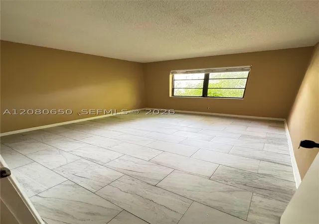 Photo 3 of Condo for sale at 3129 Oakland Shrs Dr #A109, Oakland Park, FL 33309 | MLS# A12080650 | Listing updated on 2026-09-11