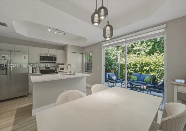 Photo 1 of Townhouse for sale at 4965 W White Mangrove Way #102-1, Dania Beach, FL 33312 | MLS# A12073215 | Listing updated on 2026-09-01