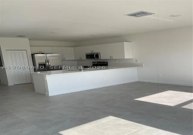 Photo 3 of Townhouse for sale at 11872 Sw 247th Terrace, Homestead, FL 33032 | MLS# A12080810 | Listing updated on 2026-09-10