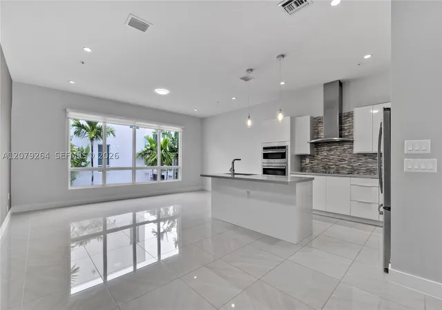 Photo 3 of Townhouse for sale at 10517 Nw 66th Street, Doral, FL 33178 | MLS# A12079264 | Listing updated on 2026-09-01