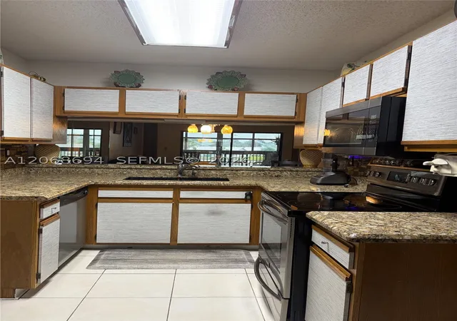 Photo 3 of Condo for sale at 9830 W Mcnab Rd #208, Tamarac, FL 33321 | MLS# A12068694 | Listing updated on 2026-09-03
