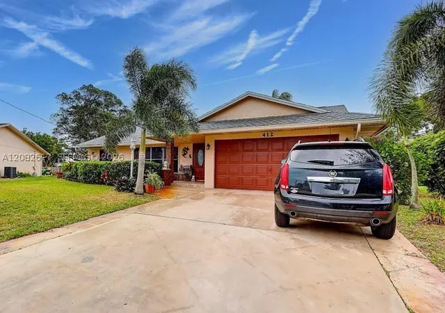 Photo 2 of Single family home for sale at 412 Sw Sansom Ln, Port St Lucie, FL 34953 | MLS# A12082617 | Listing updated on 2026-09-08