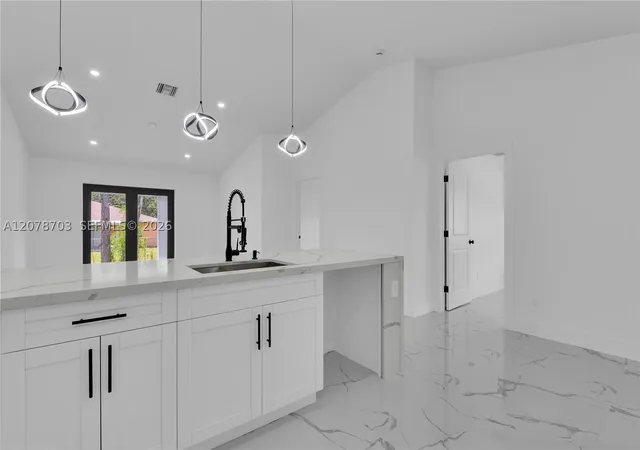 Photo 1 of Multi family home for sale at 104/106 Hightower Ave S, Lehigh Acres, FL 33973 | MLS# A12078703 | Listing updated on 2026-09-04