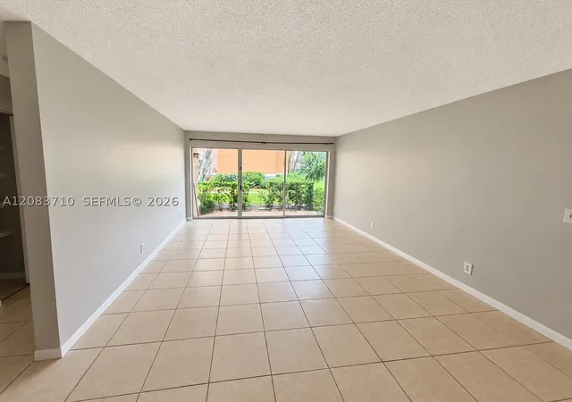 Photo 1 of Condo for sale at 8821 Wiles Rd #102, Coral Springs, FL 33067 | MLS# A12083710 | Listing updated on 2026-09-13