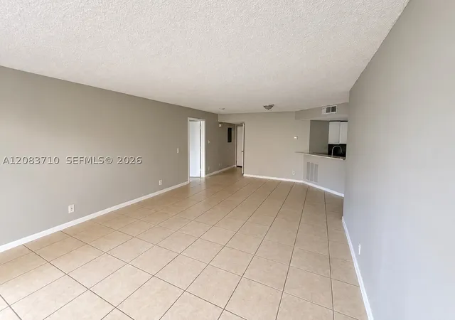 Photo 3 of Condo for sale at 8821 Wiles Rd #102, Coral Springs, FL 33067 | MLS# A12083710 | Listing updated on 2026-09-13