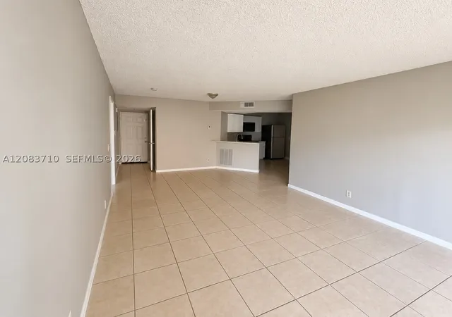 Photo 4 of Condo for sale at 8821 Wiles Rd #102, Coral Springs, FL 33067 | MLS# A12083710 | Listing updated on 2026-09-13