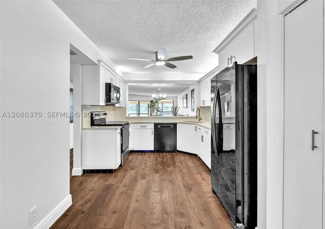 Photo 3 of Condo for sale at 7518 Fairfax Dr #110, Tamarac, FL 33321 | MLS# A12080370 | Listing updated on 2026-09-07