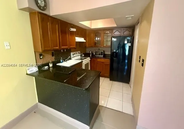 Photo 2 of Condo for sale at 12 Meacham Ln #12, Tamarac, FL 33319 | MLS# A12084064 | Listing updated on 2026-09-14