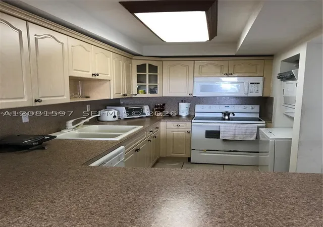 Photo 3 of Condo for sale at 10090 Nw 80th Court #1561, Hialeah Gardens, FL 33016 | MLS# A12081597 | Listing updated on 2026-09-26