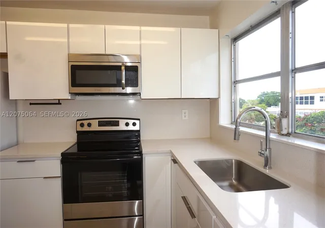 Photo 3 of Condo for sale at 4044 Nw 19th Street #404, Lauderhill, FL 33313 | MLS# A12075064 | Listing updated on 2026-09-06