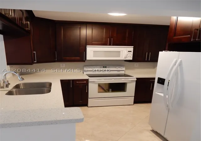 Photo 3 of Condo for sale at 5051 W Oakland Park Blvd #302, Lauderdale Lakes, FL 33313 | MLS# A12084414 | Listing updated on 2026-09-07