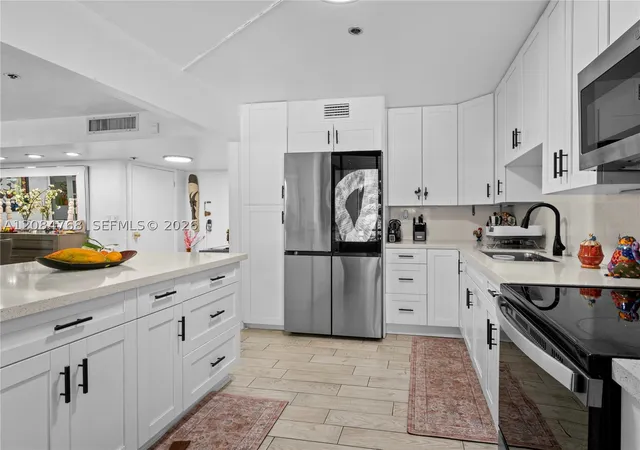 Listing Photo 1 - Condo for sale in building located at 671 Ne 195Th St, Miami, FL 33179 - Unit #329E