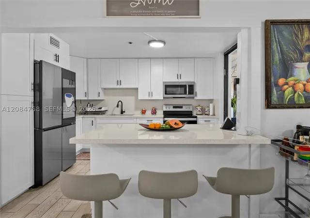 Listing Photo 3 - Condo for sale in building located at 671 Ne 195Th St, Miami, FL 33179 - Unit #329E