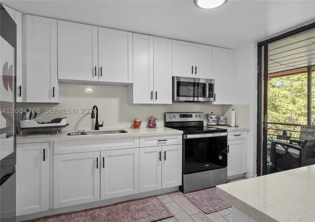 Listing Photo 4 - Condo for sale in building located at 671 Ne 195Th St, Miami, FL 33179 - Unit #329E