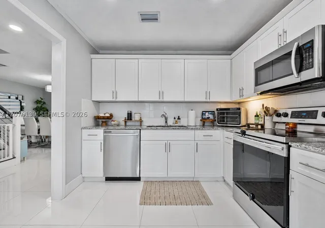 Photo 4 of Townhouse for sale at 14265 SW 97th Terrace, Miami, FL 33186 | MLS# A12076139 | Listing updated on 2026-09-14
