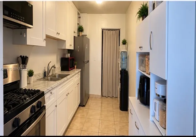 Photo 2 of Single family home for sale at 1010 E 8th Court, Hialeah, FL 33010 | MLS# A12085970 | Listing updated on 2026-10-02