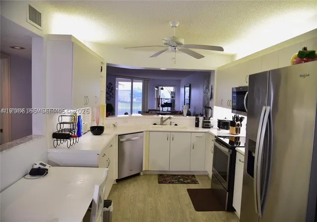Listing Photo 4 - Condo for sale in building located at 7730 Granville Dr, Tamarac, FL 33321 - Unit #202