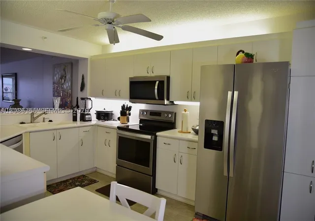 Listing Photo 5 - Condo for sale in building located at 7730 Granville Dr, Tamarac, FL 33321 - Unit #202