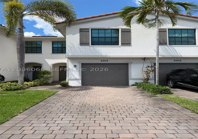 Photo 1 of Townhouse for sale at 5013 Woods Edge Cir, Riviera Beach, FL 33410 | MLS# A12086066 | Listing updated on 2026-09-11