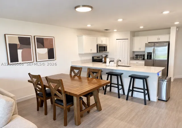 Photo 2 of Townhouse for sale at 5013 Woods Edge Cir, Riviera Beach, FL 33410 | MLS# A12086066 | Listing updated on 2026-09-11
