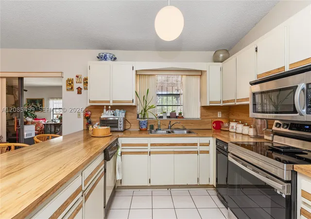 Photo 3 of Single family home for sale at 13828 SW 22nd Terrace, Miami, FL 33175 | MLS# A12085499 | Listing updated on 2026-09-10