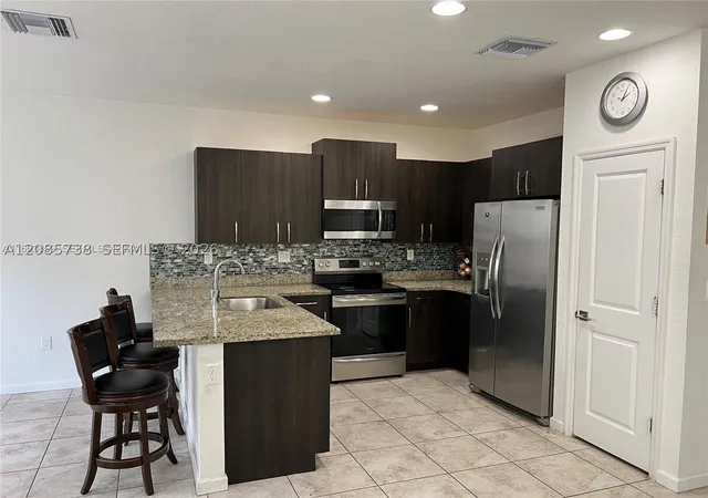 Photo 3 of Townhouse for sale at 1444 SE 24th Terrace, Homestead, FL 33035 | MLS# A12085738 | Listing updated on 2026-09-10