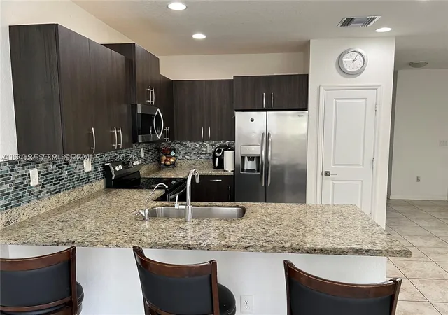 Photo 4 of Townhouse for sale at 1444 SE 24th Terrace, Homestead, FL 33035 | MLS# A12085738 | Listing updated on 2026-09-10