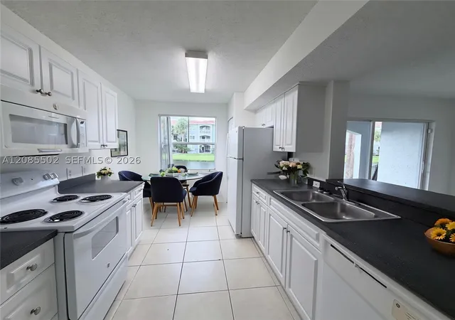 Photo 3 of Condo for sale at 9645 Nw 1st Court #1-110, Pembroke Pines, FL 33024 | MLS# A12085502 | Listing updated on 2026-09-18
