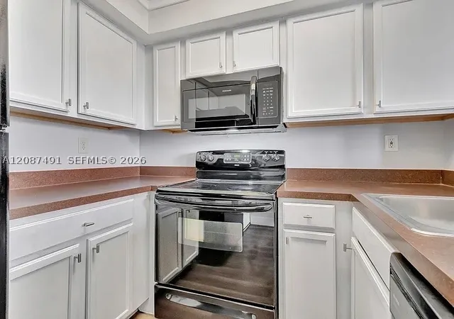 Photo 1 of Condo for sale at 714 Executive Ctr Dr #28, West Palm Beach, FL 33401 | MLS# A12087491 | Listing updated on 2026-09-12