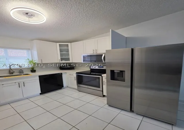 Listing Photo 5 - Condo for sale in building located at 10101 W Okeechobee Rd, Miami, FL 33016 - Unit #10-202