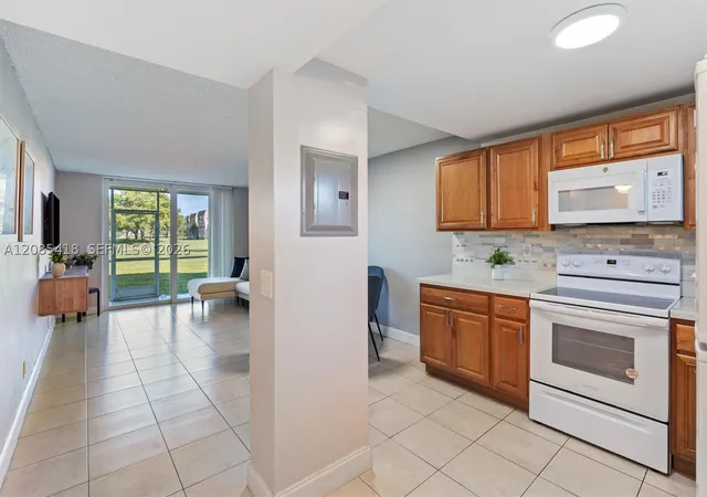 Photo 2 of Condo for sale at 9761 Sunrise Lakes Blvd #107, Sunrise, FL 33322 | MLS# A12085418 | Listing updated on 2026-09-12