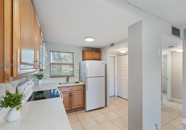 Photo 3 of Condo for sale at 9761 Sunrise Lakes Blvd #107, Sunrise, FL 33322 | MLS# A12085418 | Listing updated on 2026-09-12