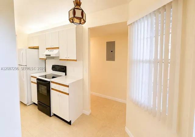 Photo 3 of Condo for sale at 12900 Sw 13th Street #413E, Pembroke Pines, FL 33027 | MLS# A12087296 | Listing updated on 2026-09-12
