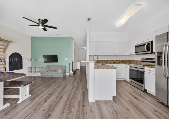 Photo 2 of Townhouse for sale at 12956 Sw 134th Terrace, Miami, FL 33186 | MLS# A12086084 | Listing updated on 2026-09-14