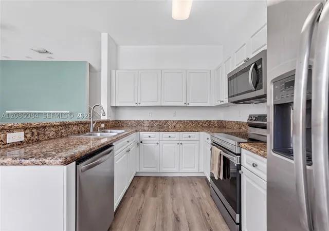 Photo 4 of Townhouse for sale at 12956 SW 134th Terrace, Miami, FL 33186 | MLS# A12086084 | Listing updated on 2026-09-14
