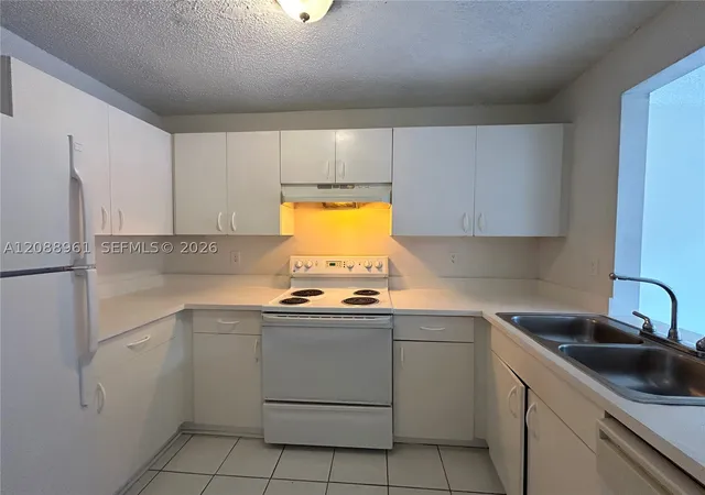 Photo 2 of Townhouse for sale at 910 E Cypress Way, Palm Springs, FL 33406 | MLS# A12088961 | Listing updated on 2026-09-15