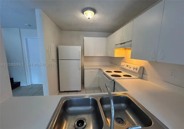 Photo 3 of Townhouse for sale at 910 E Cypress Way, Palm Springs, FL 33406 | MLS# A12088961 | Listing updated on 2026-09-15