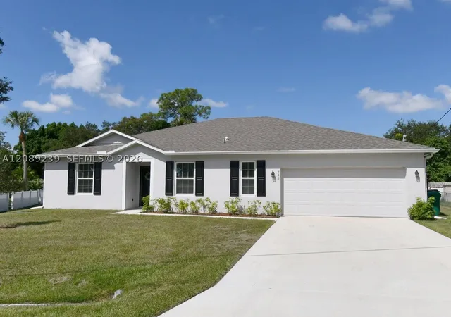 Single family home for sale at 702 SW Aster Rd, Port St Lucie, FL 34953 | MLS# A12089239