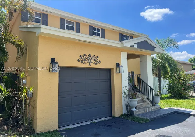 Photo 2 of Single family home for sale at 5788 Woodland Point Dr, Tamarac, FL 33319 | MLS# A12090841 | Listing updated on 2026-09-17