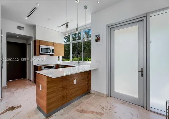 Photo 1 of Townhouse for sale at 548 Fernwood Rd #548, Key Biscayne, FL 33149 | MLS# A12091112 | Listing updated on 2026-09-19