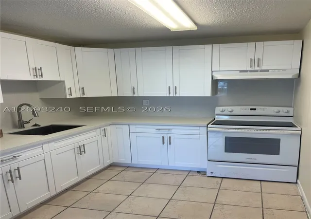 Photo 4 of Condo for sale at 1325 W 68th Street #221, Hialeah, FL 33014 | MLS# A12093240 | Listing updated on 2026-09-22