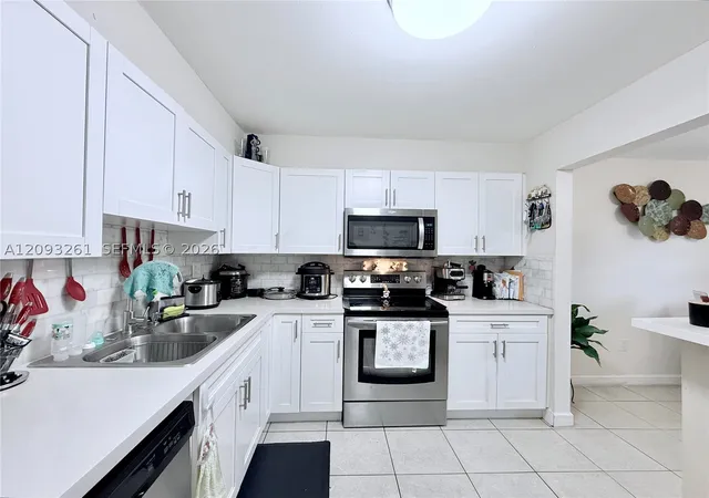 Photo 1 of Condo for sale at 1284 W 44th Place #1, Hialeah, FL 33012 | MLS# A12093261 | Listing updated on 2026-09-26