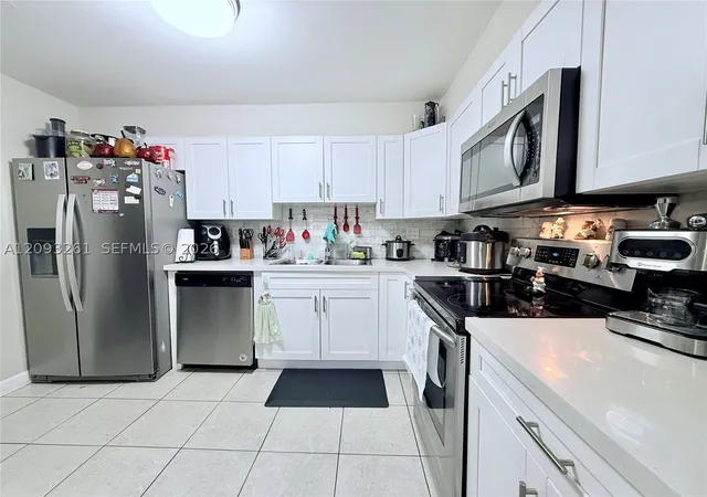 Photo 2 of Condo for sale at 1284 W 44th Place #1, Hialeah, FL 33012 | MLS# A12093261 | Listing updated on 2026-09-26