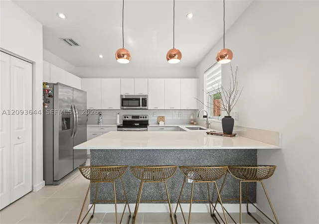 Photo 2 of Townhouse for sale at 12201 NW 23rd Court, Miami, FL 33167 | MLS# A12093644 | Listing updated on 2026-09-22